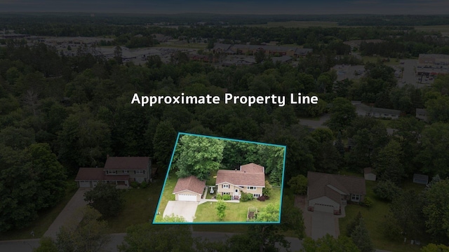 1902 3rd Ave, Grand Rapids, MN 55744 - aerial overview of property's location featuring a forest and property boundaries highlighted
