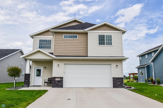 412 Hampton Dr W, Moorhead, MN 56560 - craftsman-style home featuring stone siding, an attached garage, a front yard, and driveway