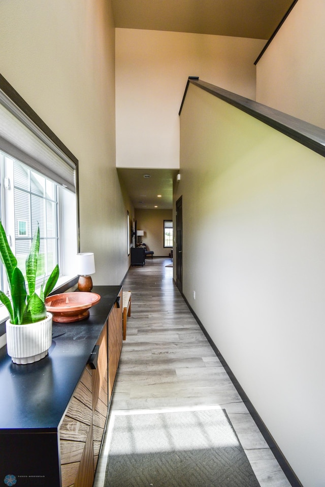 412 Hampton Dr W, Moorhead, MN 56560 - hall featuring light wood-type flooring and a towering ceiling
