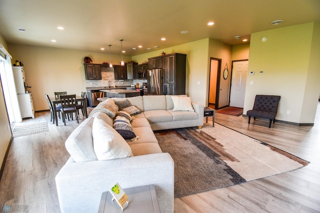 412 Hampton Dr W, Moorhead, MN 56560 - living area with light wood-style flooring and recessed lighting
