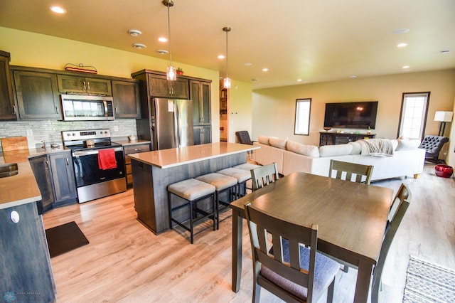 412 Hampton Dr W, Moorhead, MN 56560 - dining area featuring plenty of natural light, light wood-style flooring, and recessed lighting