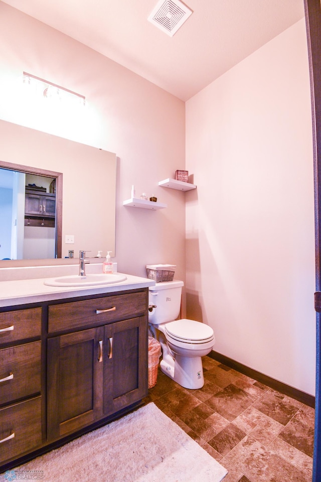 412 Hampton Dr W, Moorhead, MN 56560 - bathroom with vanity and stone finish floors