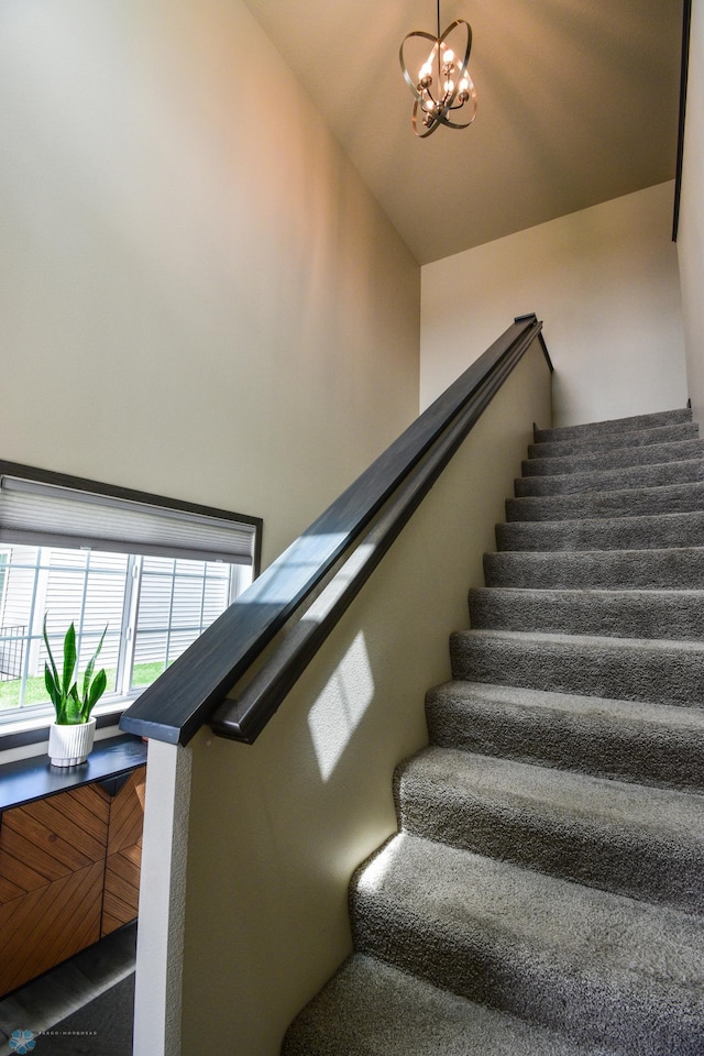 412 Hampton Dr W, Moorhead, MN 56560 - stairway with a chandelier and lofted ceiling