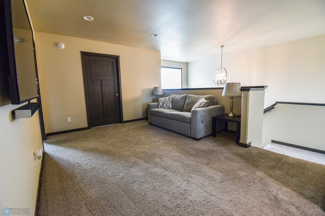 412 Hampton Dr W, Moorhead, MN 56560 - carpeted living area featuring a chandelier and baseboards