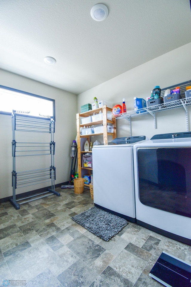412 Hampton Dr W, Moorhead, MN 56560 - washroom featuring independent washer and dryer and stone finish flooring