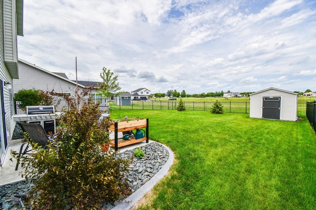 412 Hampton Dr W, Moorhead, MN 56560 - fenced backyard featuring a storage shed