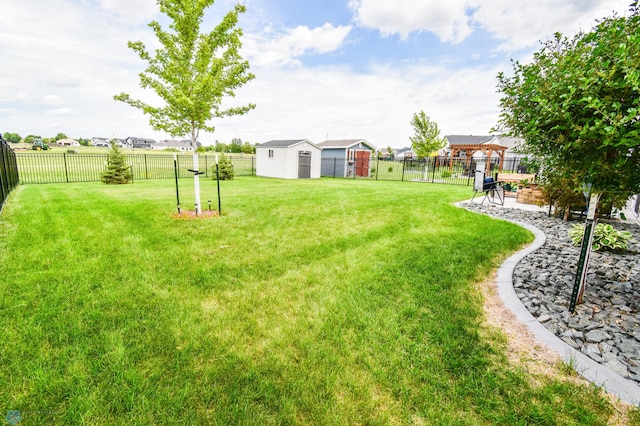 412 Hampton Dr W, Moorhead, MN 56560 - fenced backyard featuring a shed