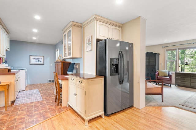 56668 145th Ave, West Concord, MN 55985 - kitchen featuring stainless steel refrigerator with ice dispenser, cream cabinets, recessed lighting, washer / dryer, and glass insert cabinets