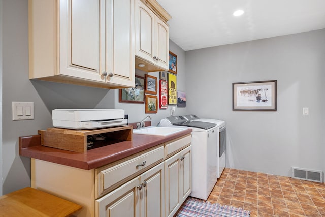 56668 145th Ave, West Concord, MN 55985 - laundry area featuring washing machine and clothes dryer and cabinet space