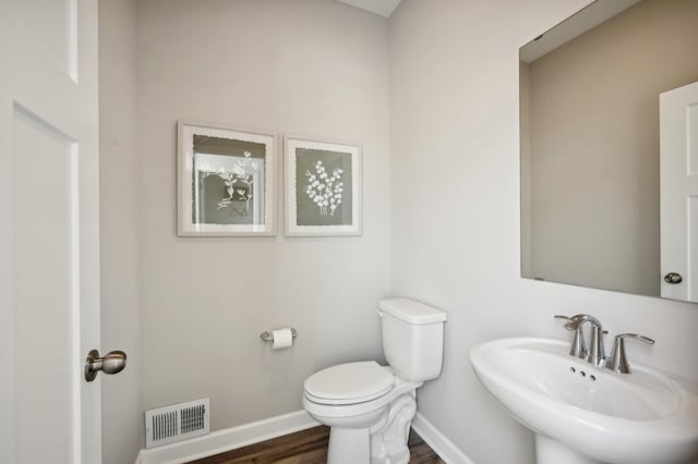 912 Harvest Trl, Buffalo, MN 55313 - half bath with a sink and wood finished floors