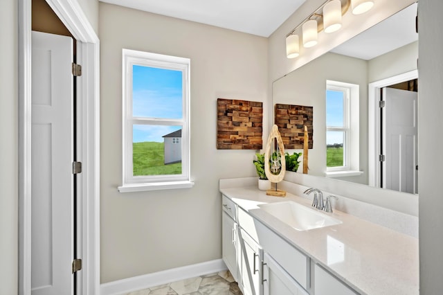 912 Harvest Trl, Buffalo, MN 55313 - bathroom featuring vanity and marble look tiles