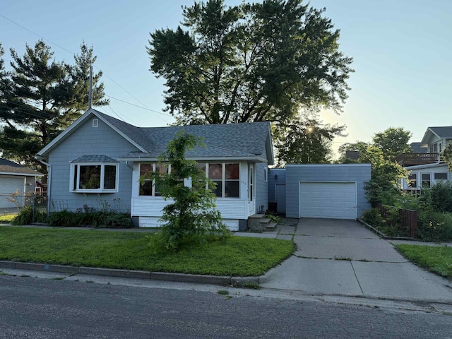 463 Liberty St, Winona, MN 55987 - view of front of home with a garage, roof with shingles, and concrete driveway