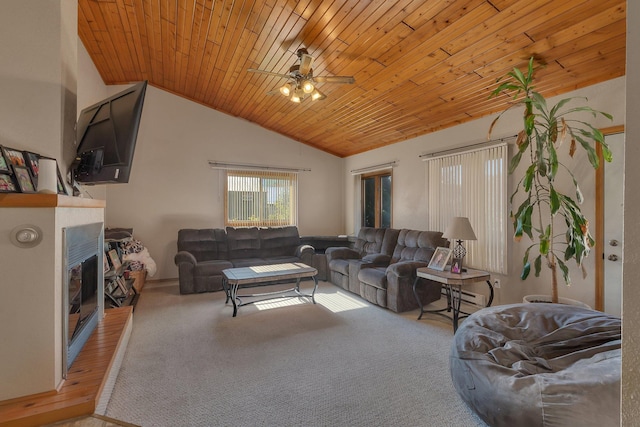 302 3rd Ave N, Bowlus, MN 56314 - carpeted living area featuring vaulted ceiling, a fireplace, a ceiling fan, wood ceiling, and a baseboard radiator