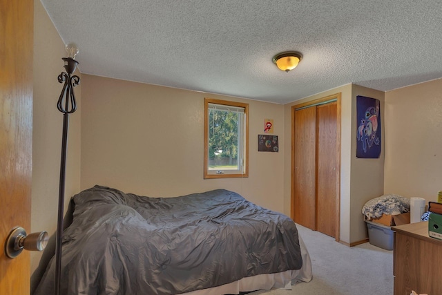 302 3rd Ave N, Bowlus, MN 56314 - bedroom featuring carpet flooring, a textured ceiling, and a closet