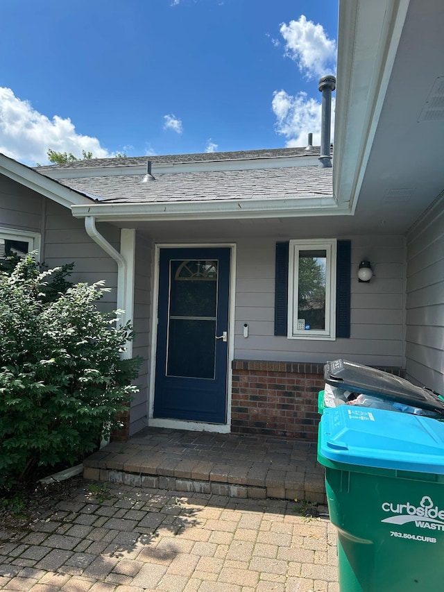 3324 131st Ln NW, Coon Rapids, MN 55448 - entrance to property featuring brick siding and roof with shingles
