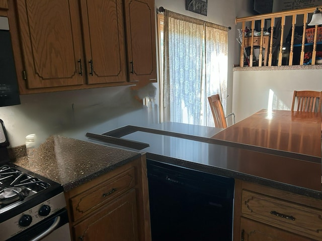 3324 131st Ln NW, Coon Rapids, MN 55448 - kitchen with black dishwasher, stainless steel range with gas cooktop, dark countertops, and brown cabinets