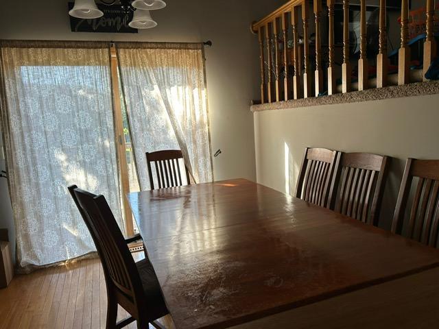 3324 131st Ln NW, Coon Rapids, MN 55448 - dining space featuring hardwood / wood-style flooring