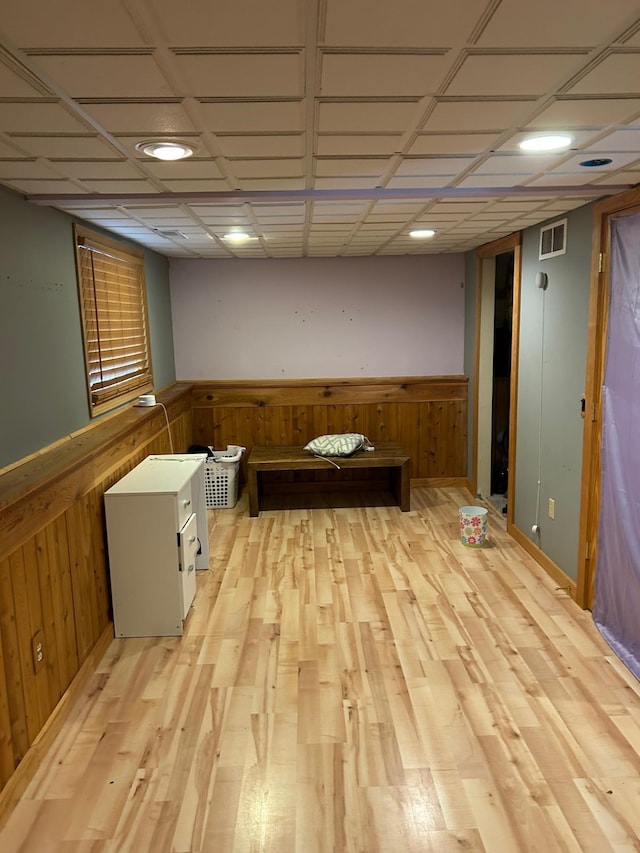 3324 131st Ln NW, Coon Rapids, MN 55448 - finished below grade area with a wainscoted wall, wooden walls, and light wood finished floors