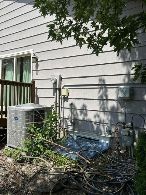 3324 131st Ln NW, Coon Rapids, MN 55448 - exterior view of a central AC unit and gas meter