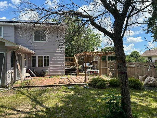 3324 131st Ln NW, Coon Rapids, MN 55448 - view of yard featuring a deck and a pergola