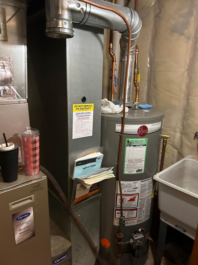 3324 131st Ln NW, Coon Rapids, MN 55448 - utilities with water heater and a sink