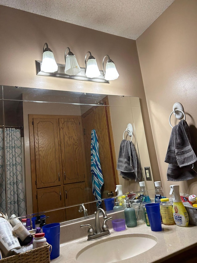 3324 131st Ln NW, Coon Rapids, MN 55448 - bathroom featuring vanity and a textured ceiling