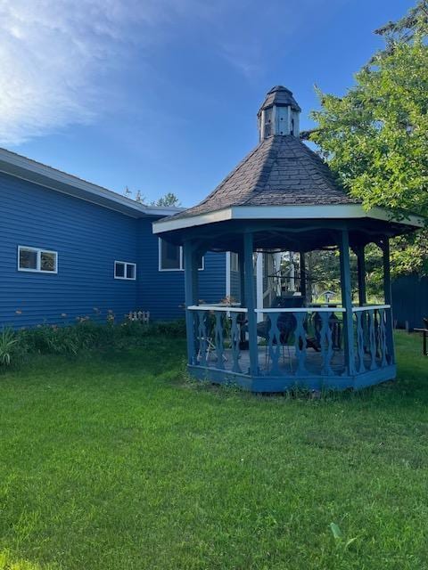 670 23rd Ave NE, Sauk Rapids, MN 56379 - rear view of house with a yard and a gazebo
