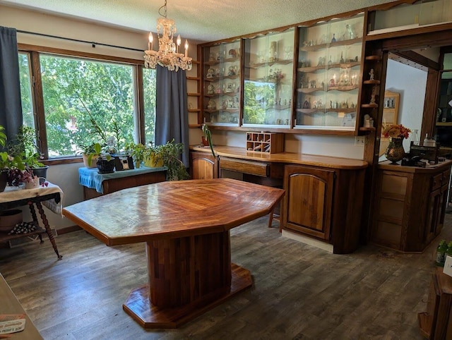 670 23rd Ave NE, Sauk Rapids, MN 56379 - dining room featuring a chandelier, dark wood finished floors, and a textured ceiling