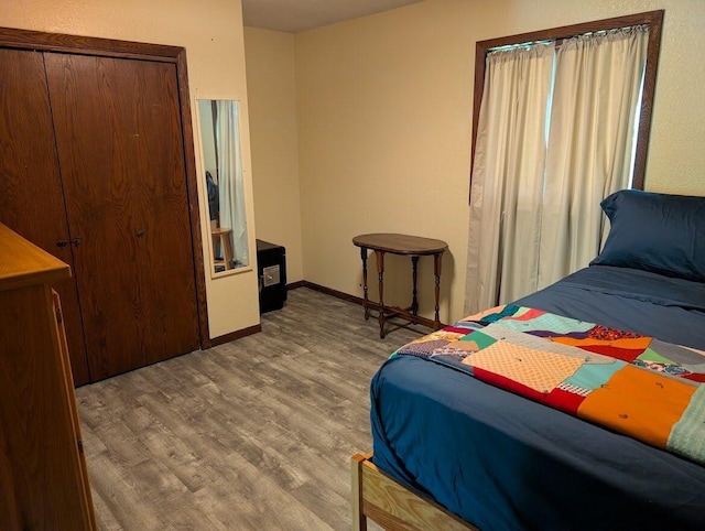 670 23rd Ave NE, Sauk Rapids, MN 56379 - bedroom with wood finished floors and baseboards