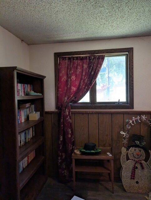 670 23rd Ave NE, Sauk Rapids, MN 56379 - sitting room with a textured ceiling and wood finished floors