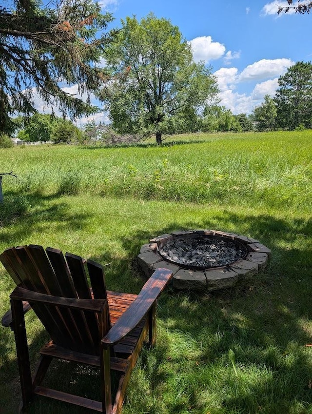 670 23rd Ave NE, Sauk Rapids, MN 56379 - view of yard featuring a fire pit