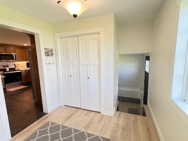 2812 150th St, Maxwell Twp, MN 56232 - hall featuring wood finished floors and baseboards