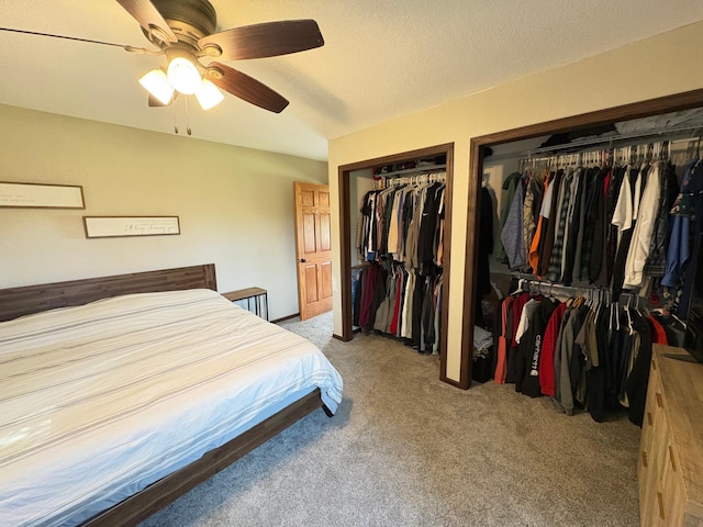 2812 150th St, Maxwell Twp, MN 56232 - carpeted bedroom with multiple closets and a ceiling fan