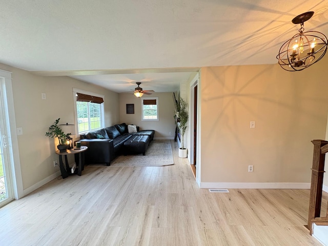 2812 150th St, Maxwell Twp, MN 56232 - living area featuring light wood-type flooring, a chandelier, and ceiling fan