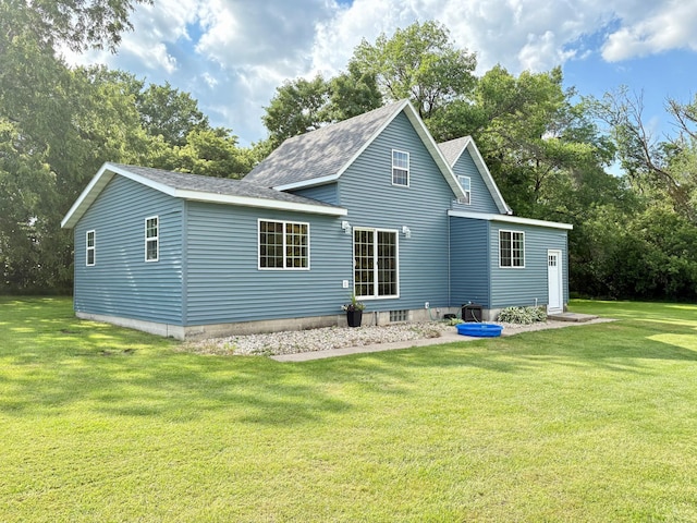 2812 150th St, Maxwell Twp, MN 56232 - back of house with a lawn and a shingled roof