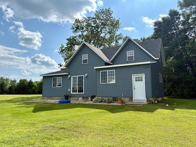 2812 150th St, Maxwell Twp, MN 56232 - back of house featuring a lawn and a shingled roof