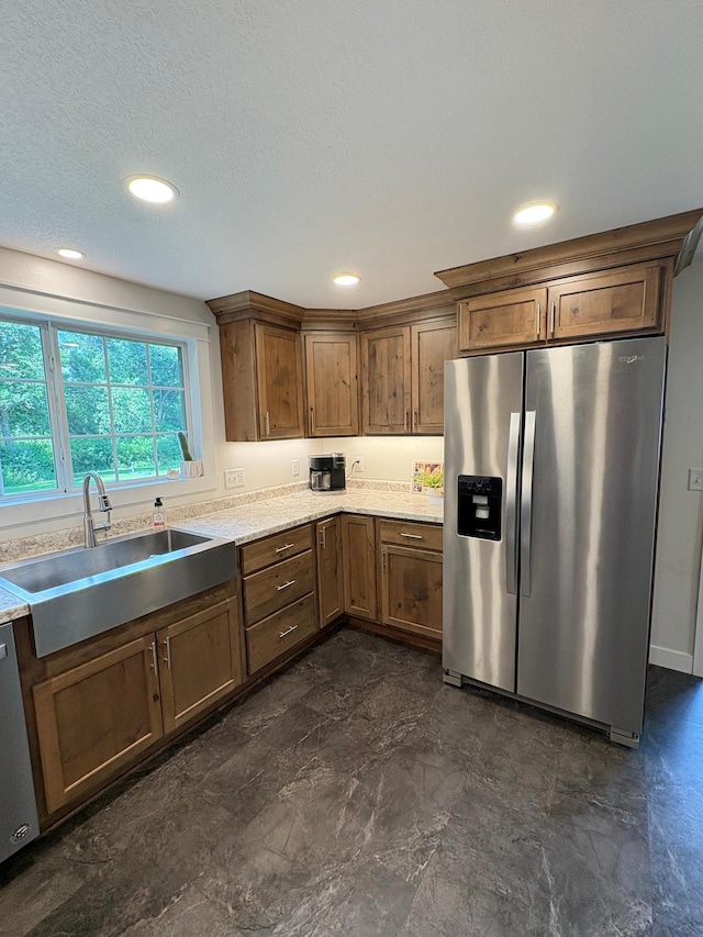 2812 150th St, Maxwell Twp, MN 56232 - kitchen with stainless steel refrigerator with ice dispenser, dishwashing machine, light countertops, brown cabinetry, and recessed lighting