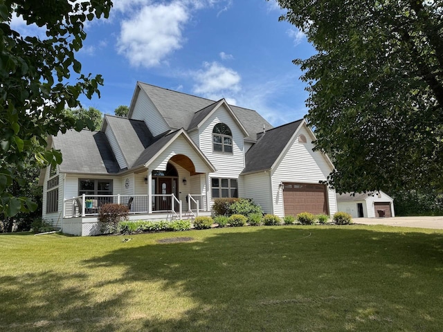 14158 185th Ave NE, Smiley Twp, MN 56701 - traditional-style house featuring a front yard, a garage, covered porch, driveway, and roof with shingles