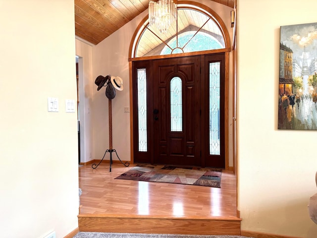 14158 185th Ave NE, Smiley Twp, MN 56701 - entrance foyer with a chandelier, lofted ceiling, wood finished floors, and wooden ceiling