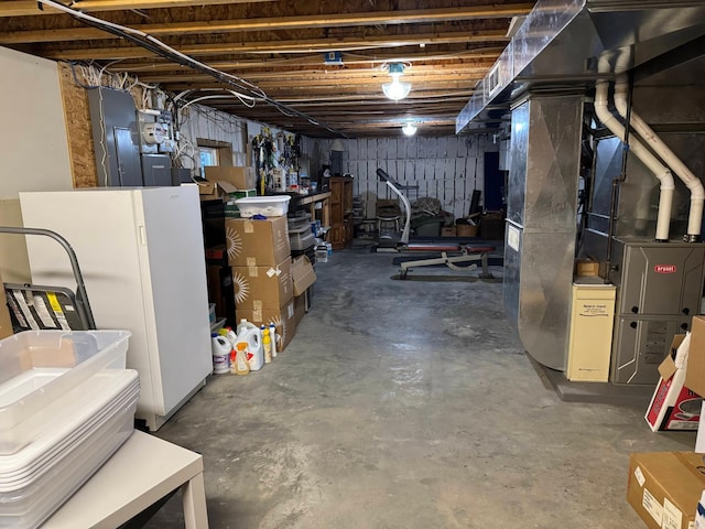 14158 185th Ave NE, Smiley Twp, MN 56701 - unfinished below grade area with freestanding refrigerator and heating unit
