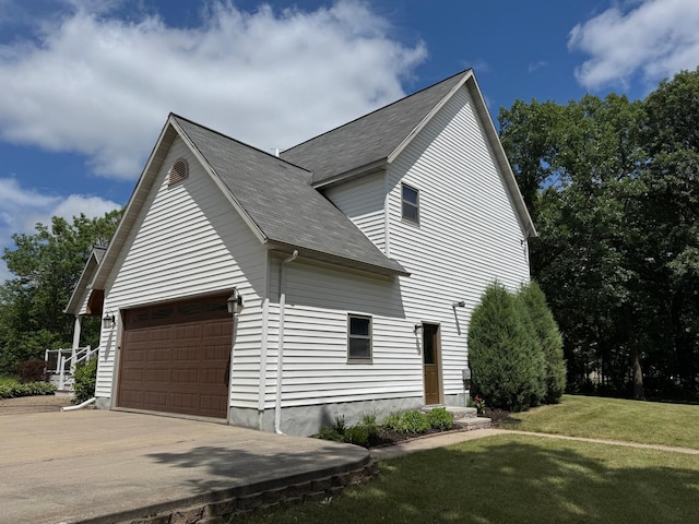 14158 185th Ave NE, Smiley Twp, MN 56701 - view of side of property with a yard, driveway, and a shingled roof