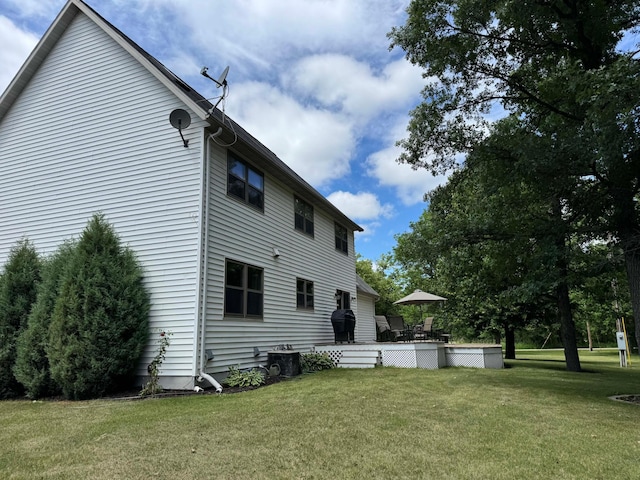 14158 185th Ave NE, Smiley Twp, MN 56701 - rear view of property with a lawn and a deck