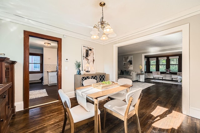 983 18th Ave SE, Minneapolis, MN 55414 - dining room featuring a chandelier, dark wood-style flooring, plenty of natural light, crown molding, and baseboard heating
