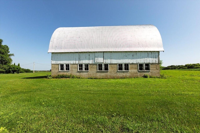 N7420 110th St, Spring Lake Twp, WI 54767 - rear view of property featuring a barn, a yard, and an outdoor structure
