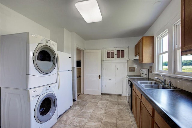 N7420 110th St, Spring Lake Twp, WI 54767 - washroom featuring stacked washing machine and dryer and stone finish flooring