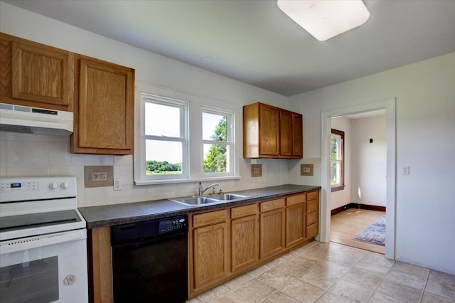 N7420 110th St, Spring Lake Twp, WI 54767 - kitchen featuring dishwasher, under cabinet range hood, white electric range oven, and brown cabinetry