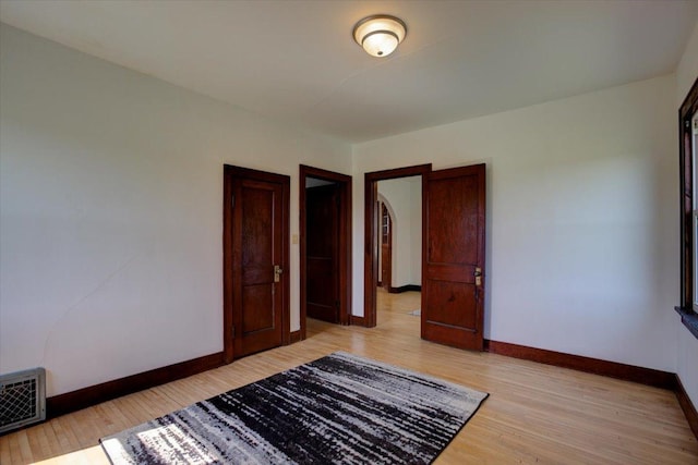 N7420 110th St, Spring Lake Twp, WI 54767 - unfurnished bedroom featuring baseboards and light wood finished floors