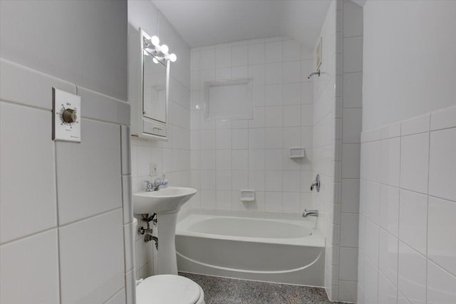 N7420 110th St, Spring Lake Twp, WI 54767 - bathroom featuring tile walls, shower / bath combination, and speckle patterned floor