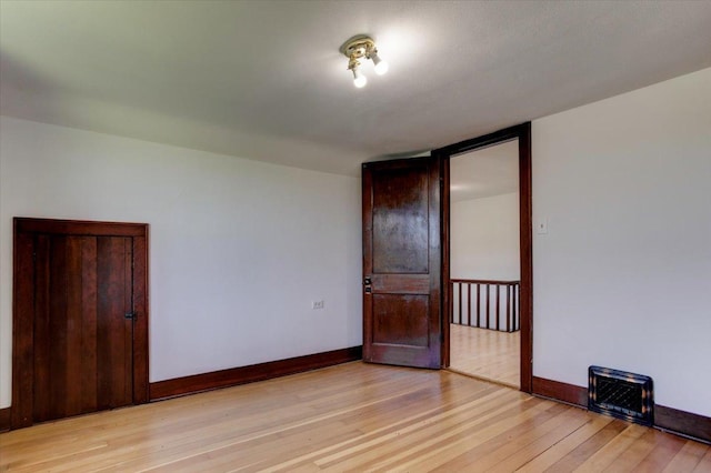 N7420 110th St, Spring Lake Twp, WI 54767 - unfurnished room featuring light wood-style floors and baseboards