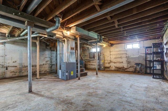 N7420 110th St, Spring Lake Twp, WI 54767 - below grade area featuring heating unit, water heater, electric panel, and stairway